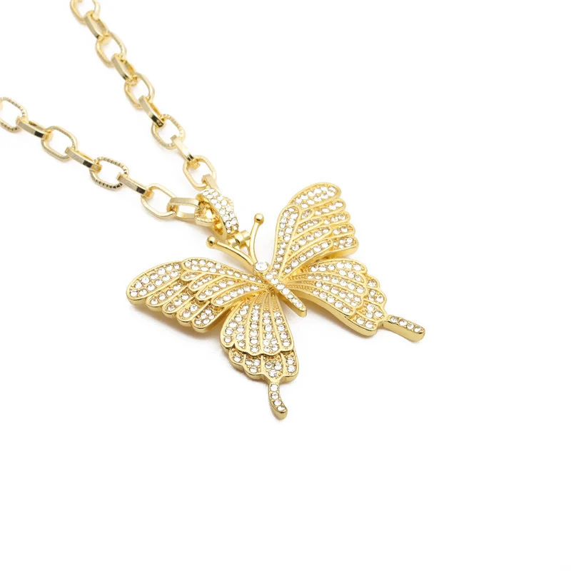 A gold butterfly pendant
