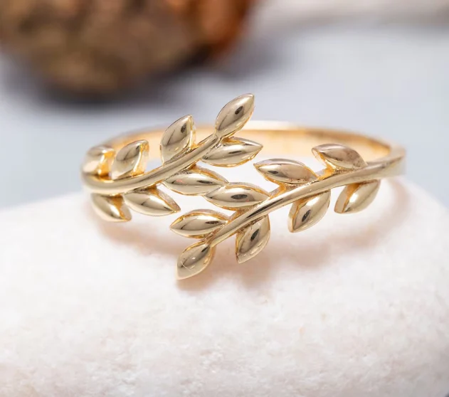 A gold olive leaf wrap ring